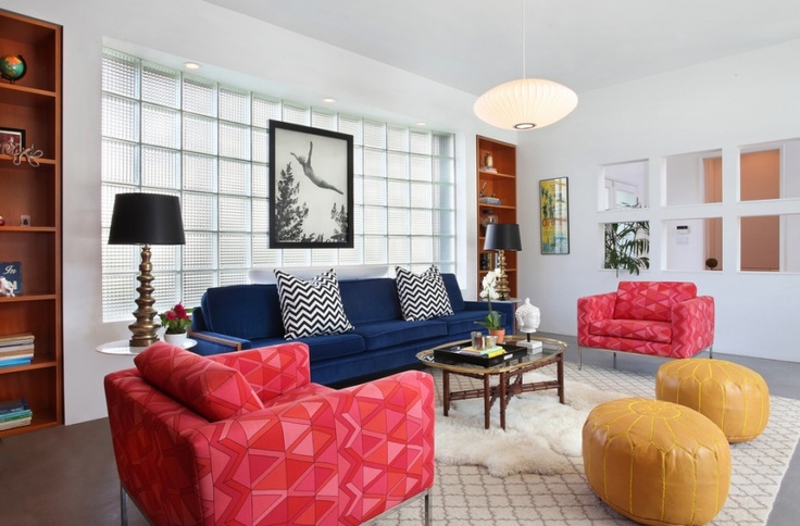 Colorful living room with blue velvet couch