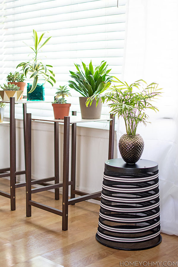 Decorate a boring trash can and repurpose it into a plant stand.  Click through for the tutorial!