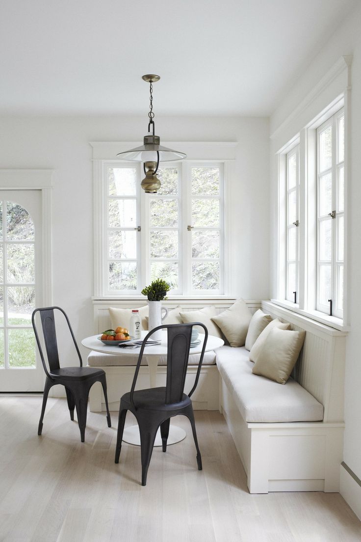 Tulip table with banquette seating