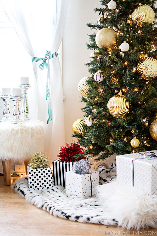 Christmas tree gold ornaments.  Use a fur throw as a simple tree skirt!