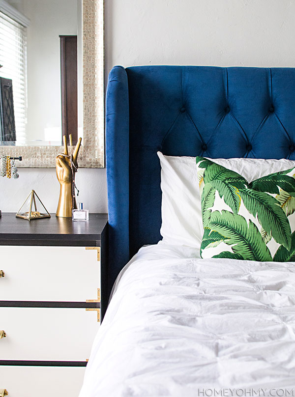 Blue headboard and banana leaf pillow